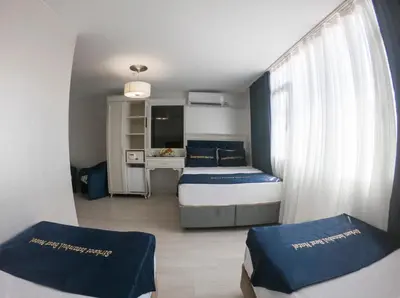 a small bedroom with a bed and a window at Seher HOTEL in Istanbul