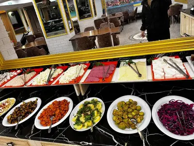 a buffet with plates of food on a counter at Seher HOTEL in Istanbul