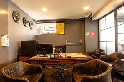 a waiting room with a table and chairs at Neda in Istanbul