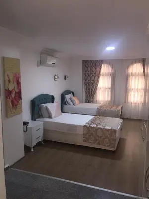 a large bedroom with two beds and a couch at Antik Ipek Hotel in Istanbul