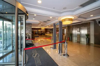 a lobby with a red ribbon in a building at Grand S Hotel in Istanbul