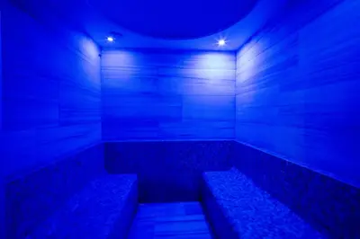 a blue room with two benches in it at Grand S Hotel in Istanbul
