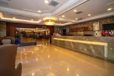 a lobby with a bar in a building at Grand S Hotel in Istanbul