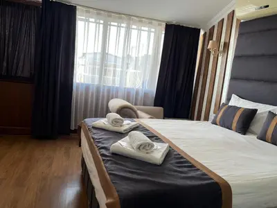 a hotel room with a bed with towels on it at Nova Roma Hotel in Istanbul