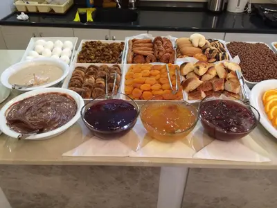 a table with a bunch of different types of food at Nova Roma Hotel in Istanbul