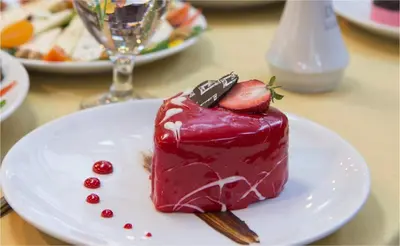 a piece of cake on a plate on a table at Dila Hotel in Istanbul