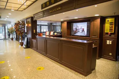 a lobby with a bar with a tv in it at Dila Hotel in Istanbul