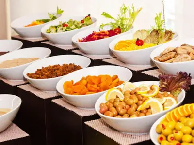 a table topped with bowls of different types of vegetables at Hermanos Hotel in Istanbul