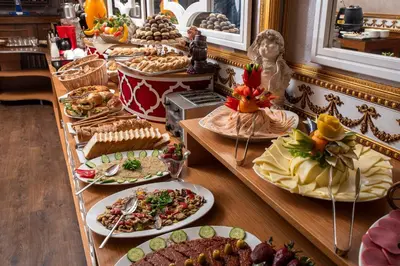 a buffet with many plates of food on a table at Senabil Hotel Old City & Spa in Istanbul