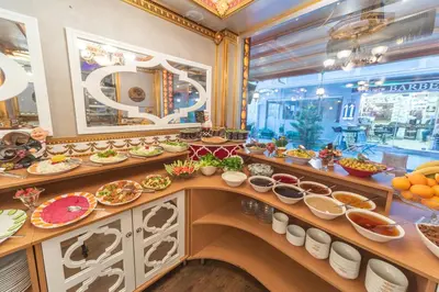a buffet line with plates of food in a restaurant at Senabil Hotel Old City & Spa in Istanbul
