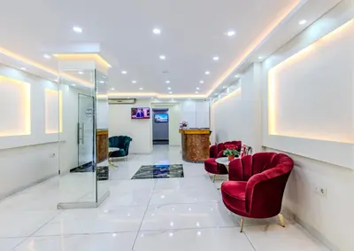 a lobby with red chairs and a table at Hotel Silviya in Istanbul
