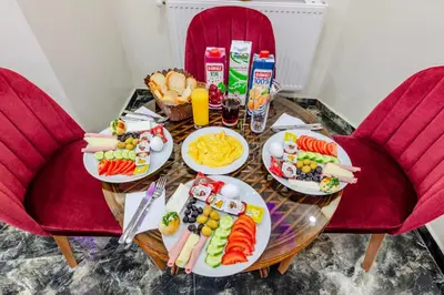 a table filled with plates of food and drinks at Hotel Silviya in Istanbul