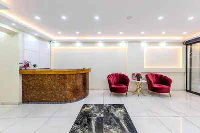a lobby with two red chairs and a bar at Hotel Silviya in Istanbul