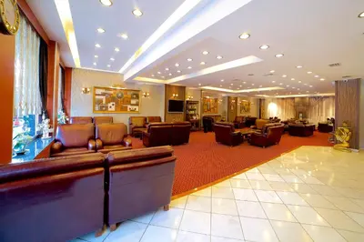 a lobby with couches and chairs in a hotel at Grand Unal Hotel in Istanbul