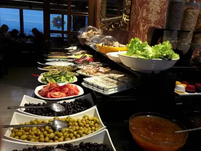 a buffet line with many different types of food at Grand Unal Hotel in Istanbul