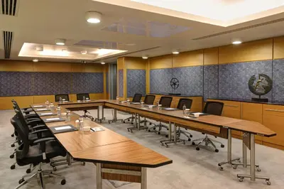 a large conference room with long tables and chairs at Divan Corlu in Corlu