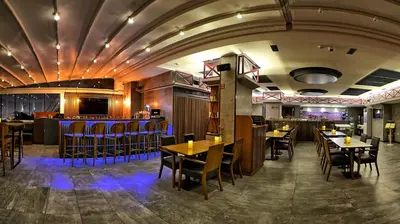 a restaurant with tables and chairs and a bar at Samir Deluxe Hotel in Istanbul