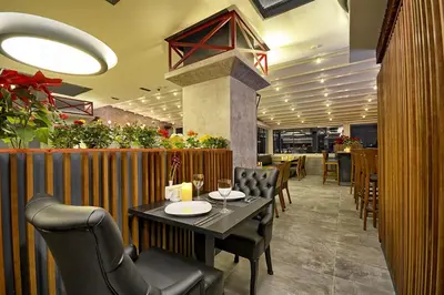 a dining room with a table and chairs in a restaurant at Samir Deluxe Hotel in Istanbul