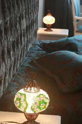 two lamps on a table next to a bed at Esans Hotel - Special Category in Istanbul