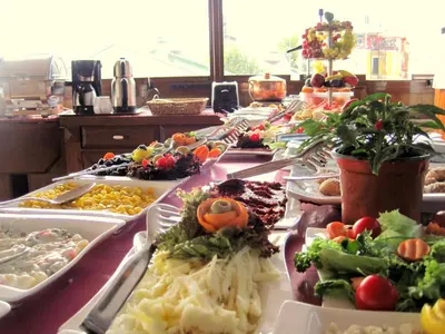 a buffet line with many different types of food at Esans Hotel - Special Category in Istanbul