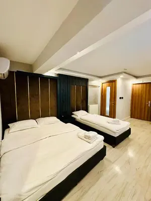 two beds in a hotel room with two bedsvisor at Sirkeci Quietness Hotel in Istanbul