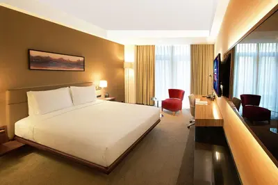 a hotel room with a white bed and a desk at DoubleTree By Hilton Istanbul - Old Town in Istanbul