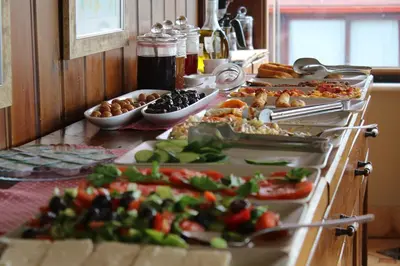 a buffet with many plates of food on a table at Emine Sultan Hotel in Istanbul