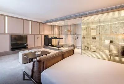 a living room with a couch and a table and a television at The Stay Nisantasi in Istanbul