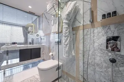 a bathroom with a toilet and a glass shower at The Stay Nisantasi in Istanbul