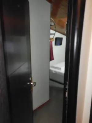 an open door to a bathroom with a toilet at Cagri Hotel in Istanbul