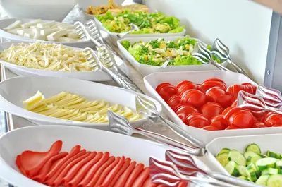 a buffet filled with bowls of different types of food at Hotel Davos Istanbul in Istanbul