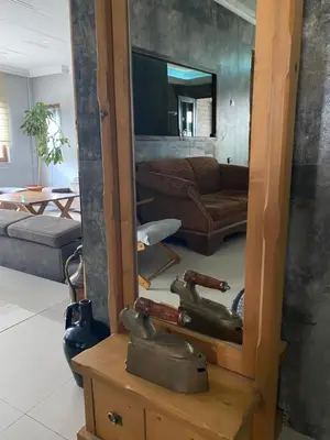 a mirror sitting on a wooden box in a living room at Odrys Beach Hotel & Resort in Tekirdag