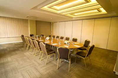 a conference room with a long table and chairs at Innpera Hotel in Istanbul