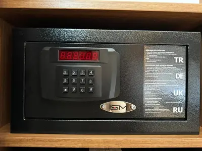 a microwave oven with a clock on top of it at Center Hill Hotel in Istanbul