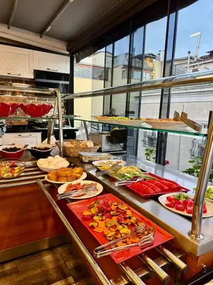 a buffet line with many different types of food at Gulhane Corner Hotel in Istanbul