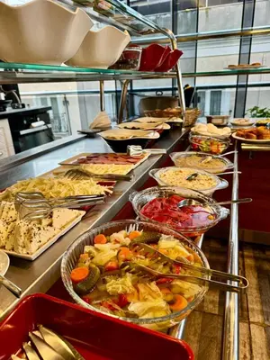 a buffet line with many different dishes of food at Gulhane Corner Hotel in Istanbul