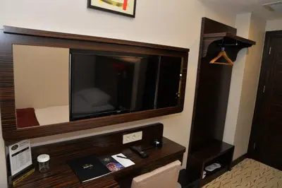 a hotel room with a large television on the wall at Golden Siyav Hotel in Istanbul