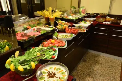 a buffet line with many different dishes of food at Golden Siyav Hotel in Istanbul