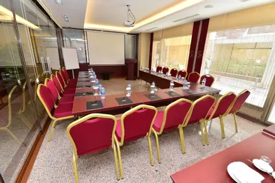 a large conference room with a long table and chairs at Golden Siyav Hotel in Istanbul