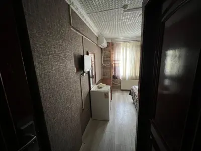 a hallway with a refrigerator in a room at Hotel Red Rose in Istanbul