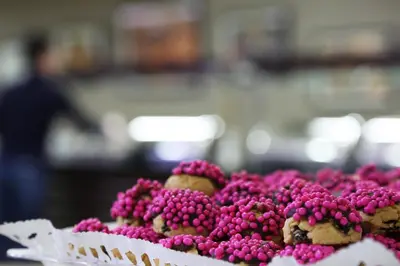 a pile of pinkberries sitting on top of a table at Benler Otel Laleli ISTanbul in Istanbul