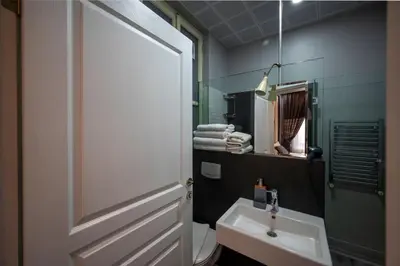 a bathroom with a sink and a toilet and a mirror at Taksim Istiklal Street Next2 Hotel in Istanbul