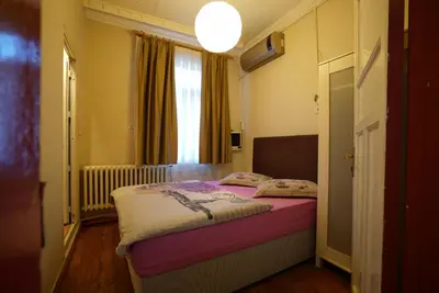 a bedroom with a bed in a room with a window at Erenler HoTeL & HosTeL in Istanbul