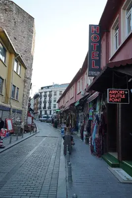 a city street with shops on the side of the road at Erenler HoTeL & HosTeL in Istanbul