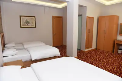 a hotel room with two beds in a room at Hotel Grand Umit in Istanbul