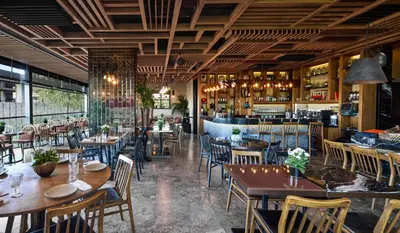 a restaurant with tables and chairs and a bar at Gezi Hotel Bosphorus, Istanbul, a Member of Design Hotels in Istanbul