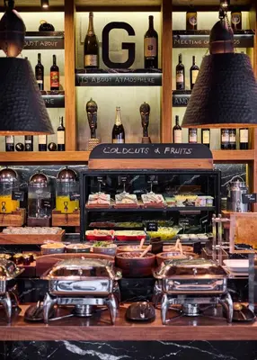 a restaurant with some food and bottles of wine at Gezi Hotel Bosphorus, Istanbul, a Member of Design Hotels in Istanbul