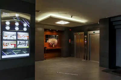 a hallway in a building with a sign on the wall at Hotel Anatolia in Bursa