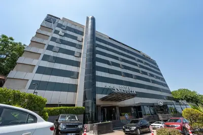 a building with cars parked in front of it at Hotel Anatolia in Bursa