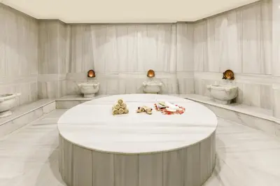 a room with a round table with four toilets at Vicenza Hotel Istanbul Old City in Istanbul